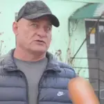 Судова зала або емблема суду, що символізує винесення вироку колаборанту з Генічеська.