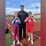 Херсонські спортсмени Анна Баш та Артем Хоменко з медалями на змаганнях з легкої атлетики
