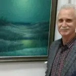Анатолій Кичинський на творчому вечорі у Рівному, читає поезії