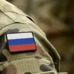 Символічне зображення правосуддя або місця злочину, що вказує на тяжкість скоєного під час окупації.